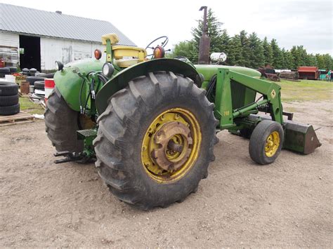 John Deere Diesel 3020 with JD 148 Loader