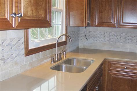 Basketweave tile backsplash with wooden cabinets and stainless steel sink #arley #basketweave # ...