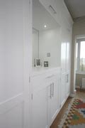 Rank of Bespoke Wardrobes with TV and Mirror Alcoves, Cupboards and Drawers