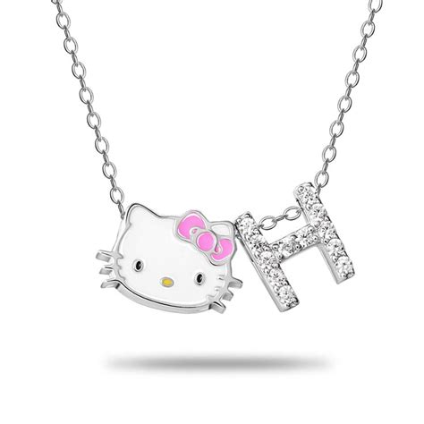 A sweet little charm of Hello Kitty dangles from this initial necklace ...