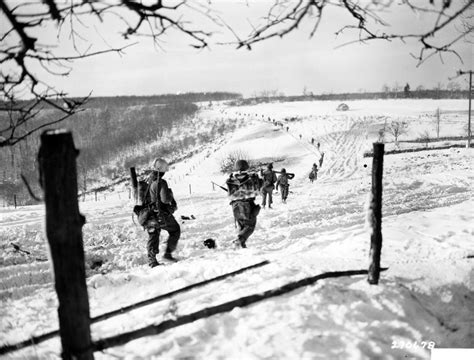 NACHMANDERSCHEID. ORIGINAL HISTORIC WARTIME CAPTION. Preceded by a tank for heavy support, men ...