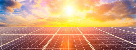 Photovoltaic solar panels on sunset sky background,green clean energy concept. Stock Photo ...