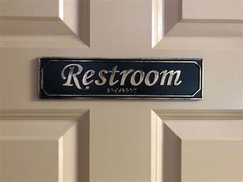 Brass Antiqued Restroom Door Sign with Braille 9 5/8" X 2 3/8" - Custom Metal Signs - KCastings, Inc