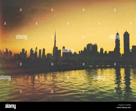 Dubai skyline at sunset Stock Photo - Alamy