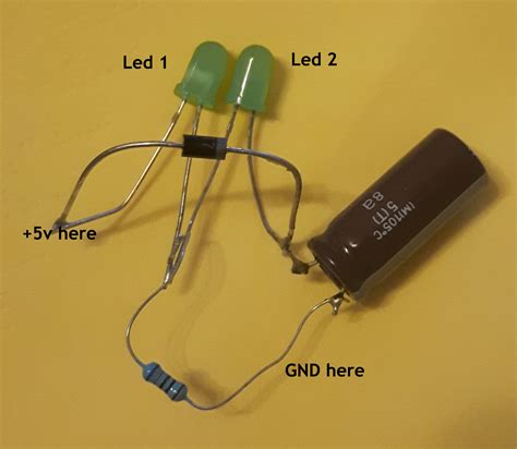 capacitor - Why both leds does not light equally when power is applied? - Electrical Engineering ...