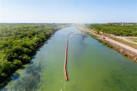 Justice Department sues Texas over floating barrier in Rio Grande intended to deter migrant ...