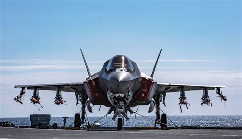 F-35 stealth jet loaded with weapons on Royal Navy carrier