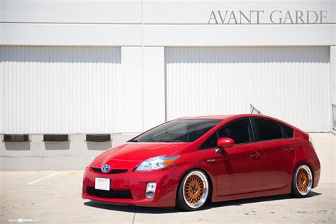 Red Toyota Prius Gets Upgraded Lighting and Bronze Avant Garde Wheels — CARiD.com Gallery