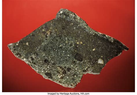 A BEAUTIFUL AND RARE METEORITE FROM KANSAS. ... Meteorites Stones | Lot #41214 | Heritage Auctions