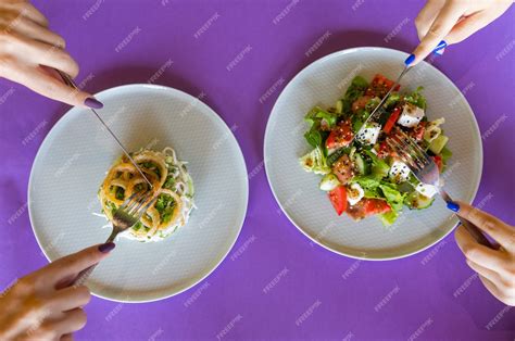 Premium Photo | Table with many salad top view. different salads on concrete table, top view ...