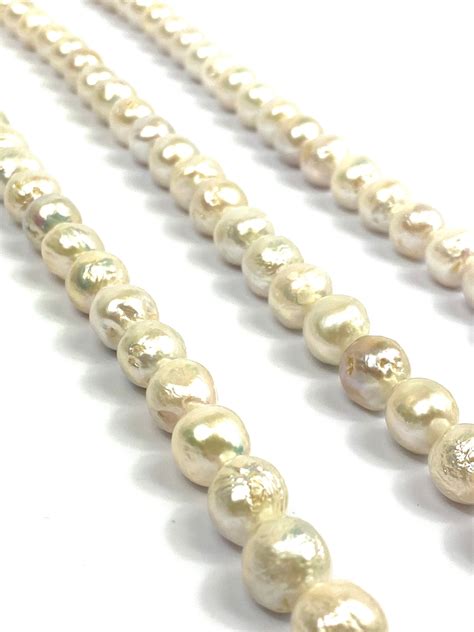 Glimmering 10mm-12mm White Edison Pearl Strands, 100% Natural Color ...