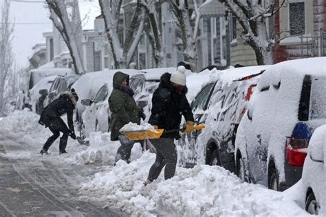 Boston shatters snowfall record, nor'easter dumps more than a foot across region