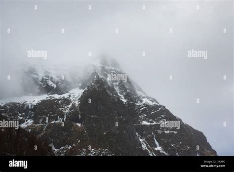 Snowy peak of mountain of Lofoten Islands in Norway Stock Photo - Alamy