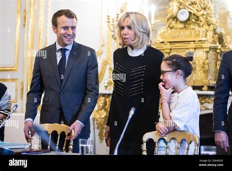 French President Emmanuel Macron and his wife Brigitte receive children ...