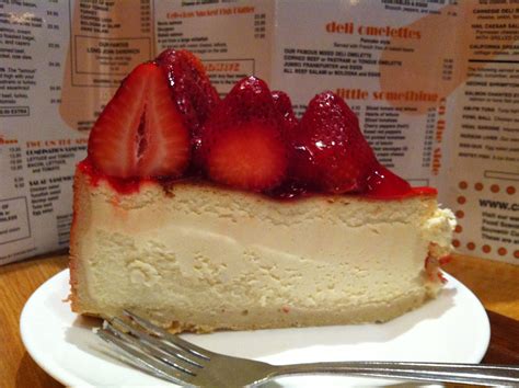 a piece of cheesecake with strawberries on top