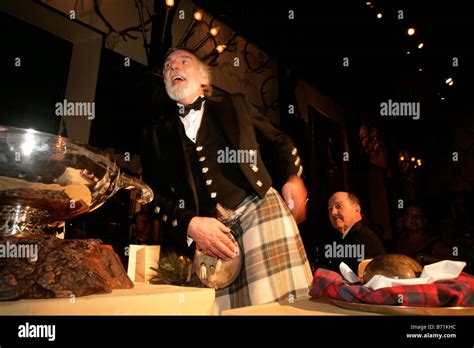 Addressing the haggis at a traditional Burns Night Supper Stock Photo ...