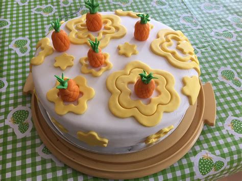 A tropical fruit cake with marzipan pineapples and extra marzipan flowers for Dad (much ...