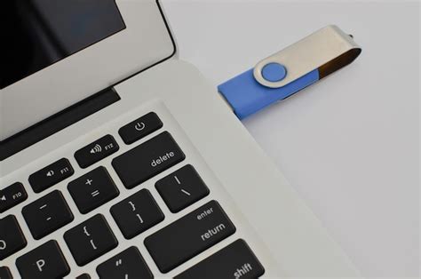 Premium Photo | Connecting possibilities usb stick inserted in laptop exploring the potential of ...