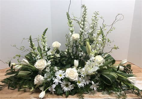 Angel White | Funeral flower arrangements, White flower arrangements, Funeral floral arrangements