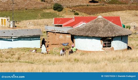 South African Family Near a Traditional Mud House in a Small Village, South Africa, Apartheid ...