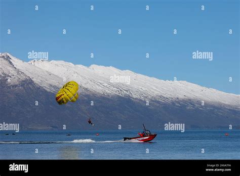 Lake Wakatipu, Queenstown , New Zealand. Tourists enjoy activities on ...