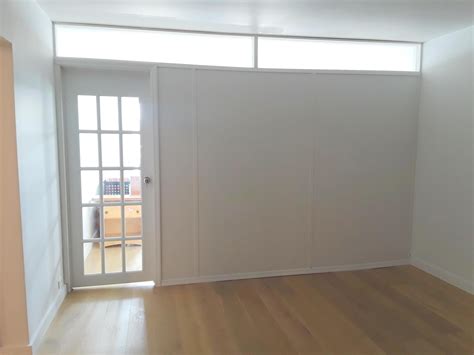 Temporary wall with plexiglass transom and French door. Call us for all ...