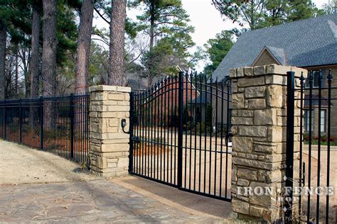 12ft Wide Iron Driveway Gate Mounted on Posts Behind Stone Columns (6 ...