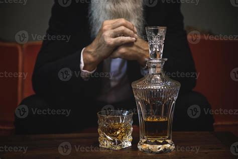 Handsome and bearded senior man drinking whiskey 14347492 Stock Photo ...