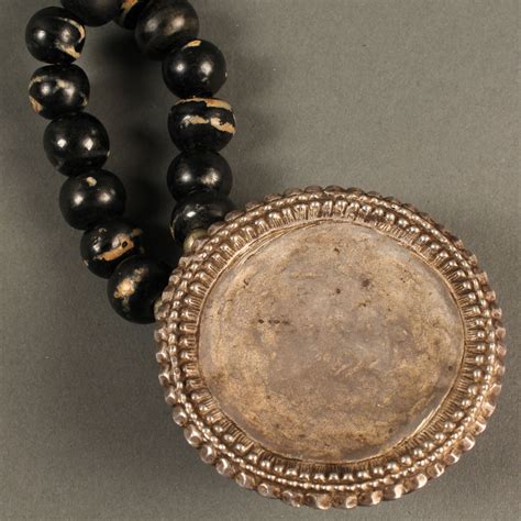 Lot 23: Rhino Horn Necklace, silver & "Tibetan agate" | Case Auctions