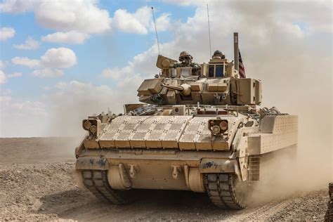 Soldiers operate a Bradley M2A3 Fighting Vehicle during a live-fire ...