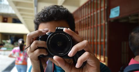 Person Holding Black Dslr Camera · Free Stock Photo