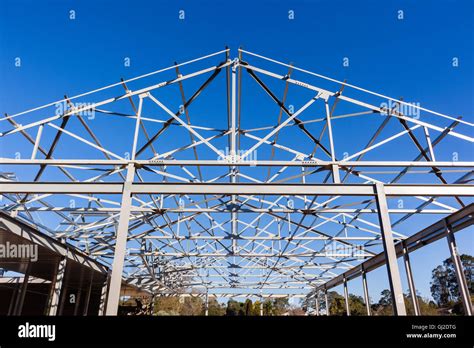 Building mid construction with steel roof frame structures raw materials Stock Photo - Alamy