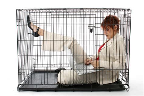 Thirty something business woman trapped in cage. - Betty Kempa I Business Coach for Coaches