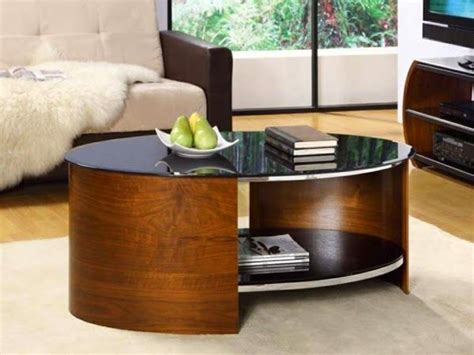 ROUND COFFEE TABLE | Round black wood coffee table in modern living room interior | Discover ...