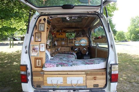 the back end of an old van with its bed in it