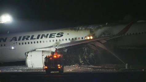 Plane catches fire on runway at Japan's Haneda airport