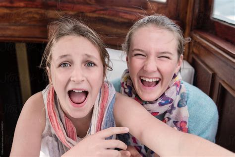 "Two Teen Girls Laughing Together" by Stocksy Contributor "Gillian Vann" - Stocksy