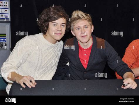 Harry Styles and Niall Horan One Direction attend a signing for their new album 'Up All night ...