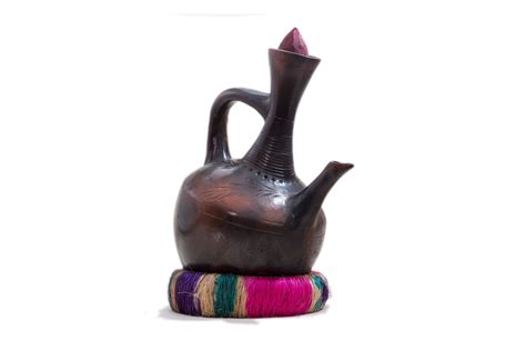 Jebena- traditional coffee pot from Ethiopia. Used to pour fresh coffee. Made from clay ...