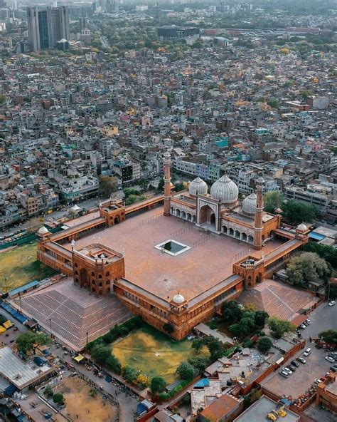 an aerial view of a large building in the middle of a city