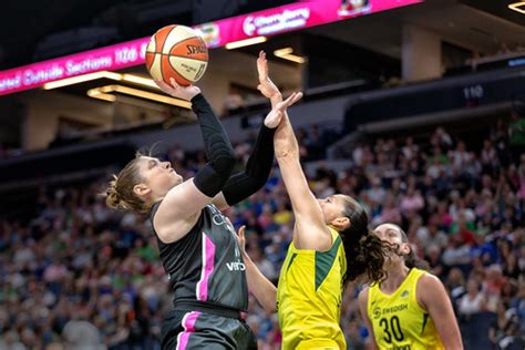 Lindsay Whalen (13) shoots the ball and guards off Sue Bir… | Flickr