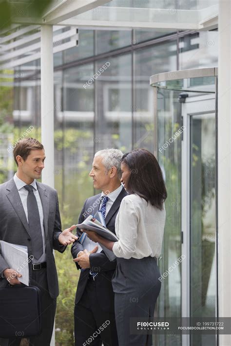 Business people talking outside of office building — businessmen, planning - Stock Photo ...