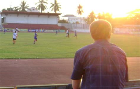 Damian Watching Football in Laos - Languagecaster.com