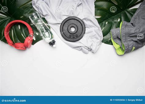 Concept of Sports Lifestyle, Sportswear and Accessories Lined Up on a White Background, with ...