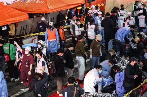 Photos: Halloween crowd chaos kills more than 150 in South Korea | Gallery News | Al Jazeera