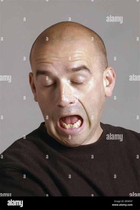 Bald 38 year old man showing a boredom expression Stock Photo - Alamy