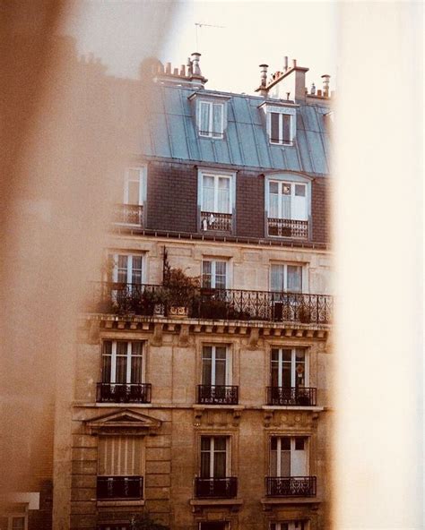 an apartment building with balconies and windows