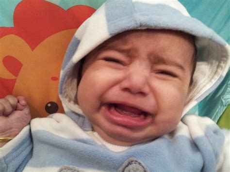 A crying baby who looks cute and funny | Baby crying, Baby, Baby face