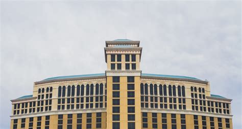 office building exterior, day, hotel, cloud - sky, bellagio hotel and casino, low angle view ...