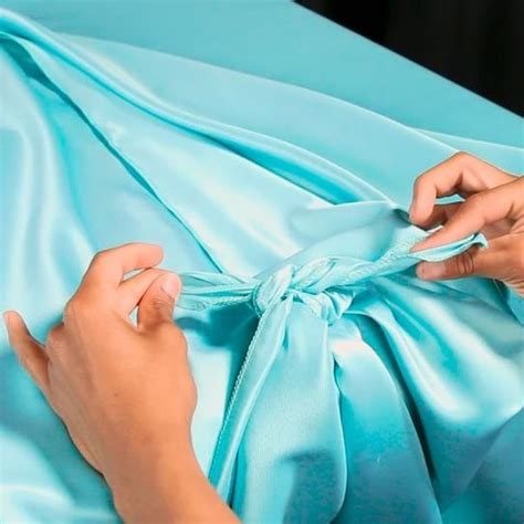 Unsure how to style a rectangular tablecloth? Drape tying it will keep those pesky corners ...